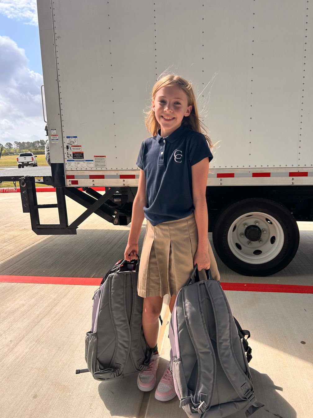Cypress Christian School students packing backpacks for Cypress Assistance Ministries
